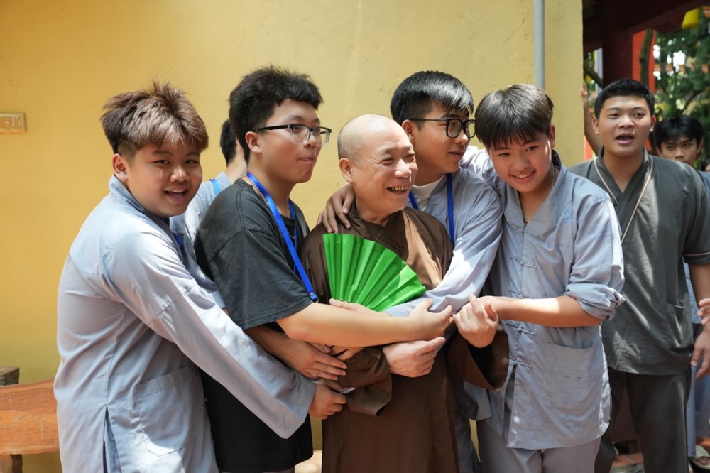 A group of people hugging each other

AI-generated content may be incorrect.
