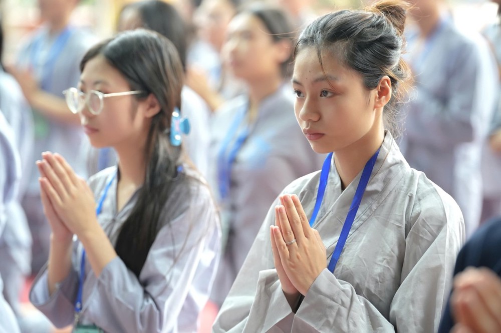 A group of women praying

AI-generated content may be incorrect.