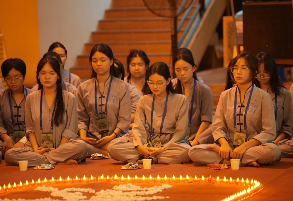 A group of women sitting on the floor with candles in the background

AI-generated content may be incorrect.