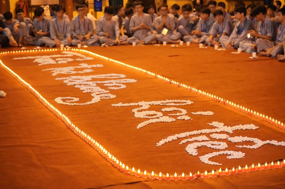 A group of people sitting in a circle with candles

AI-generated content may be incorrect.