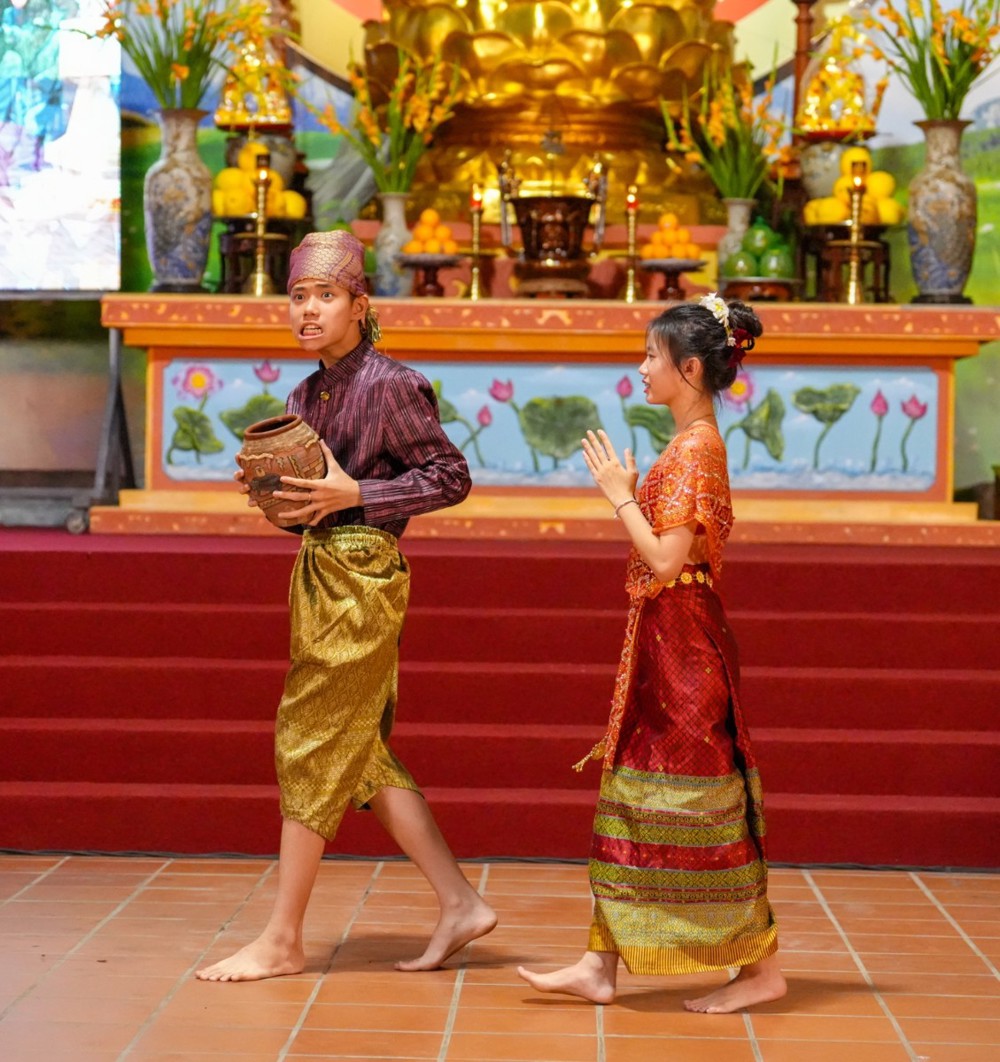 A person and person in traditional dress walking on red stairs

AI-generated content may be incorrect.